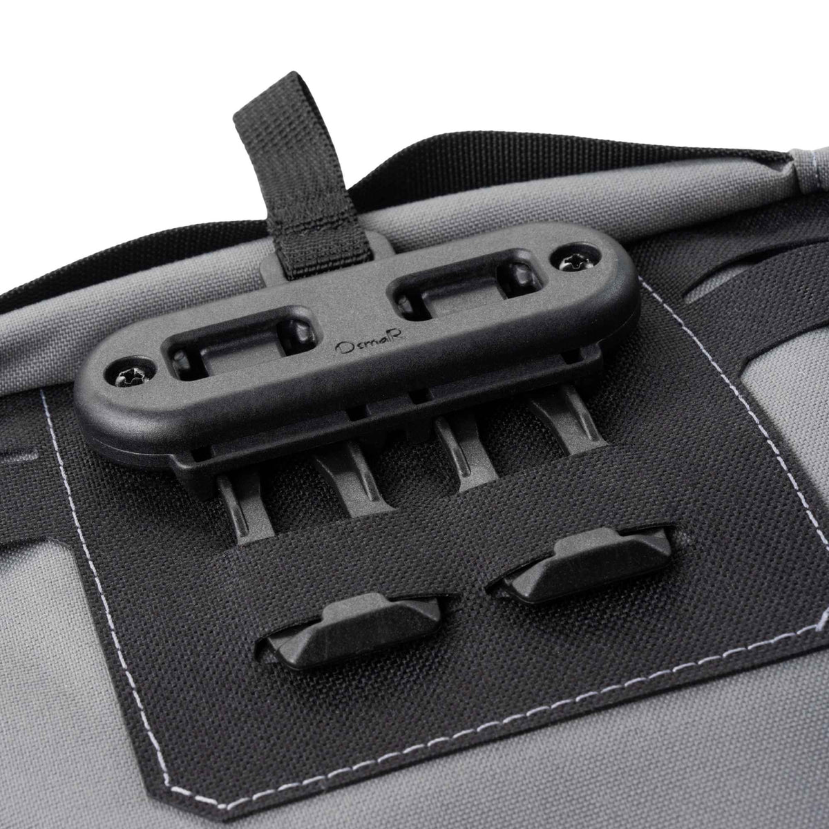 Black FHF Snapcor buckle mounted on a grey pouch.