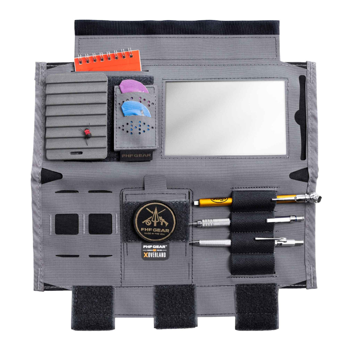 Gray car visor organizer fully open in use showing how accessories fit in, it has FHF GEAR logo in light brown and "FHF GEAR XOVERLAND" branding in the middle.