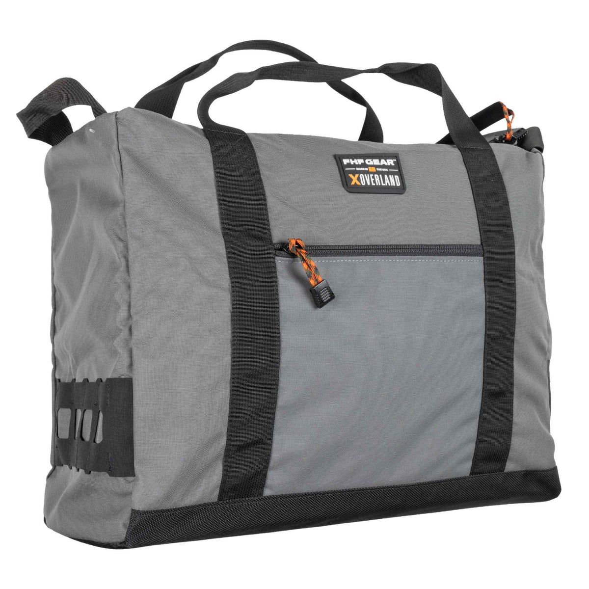 Angle look at the FHF The Stage Tote in grey with black straps, orange cords on zippers, FHF XOVERLAND branding.