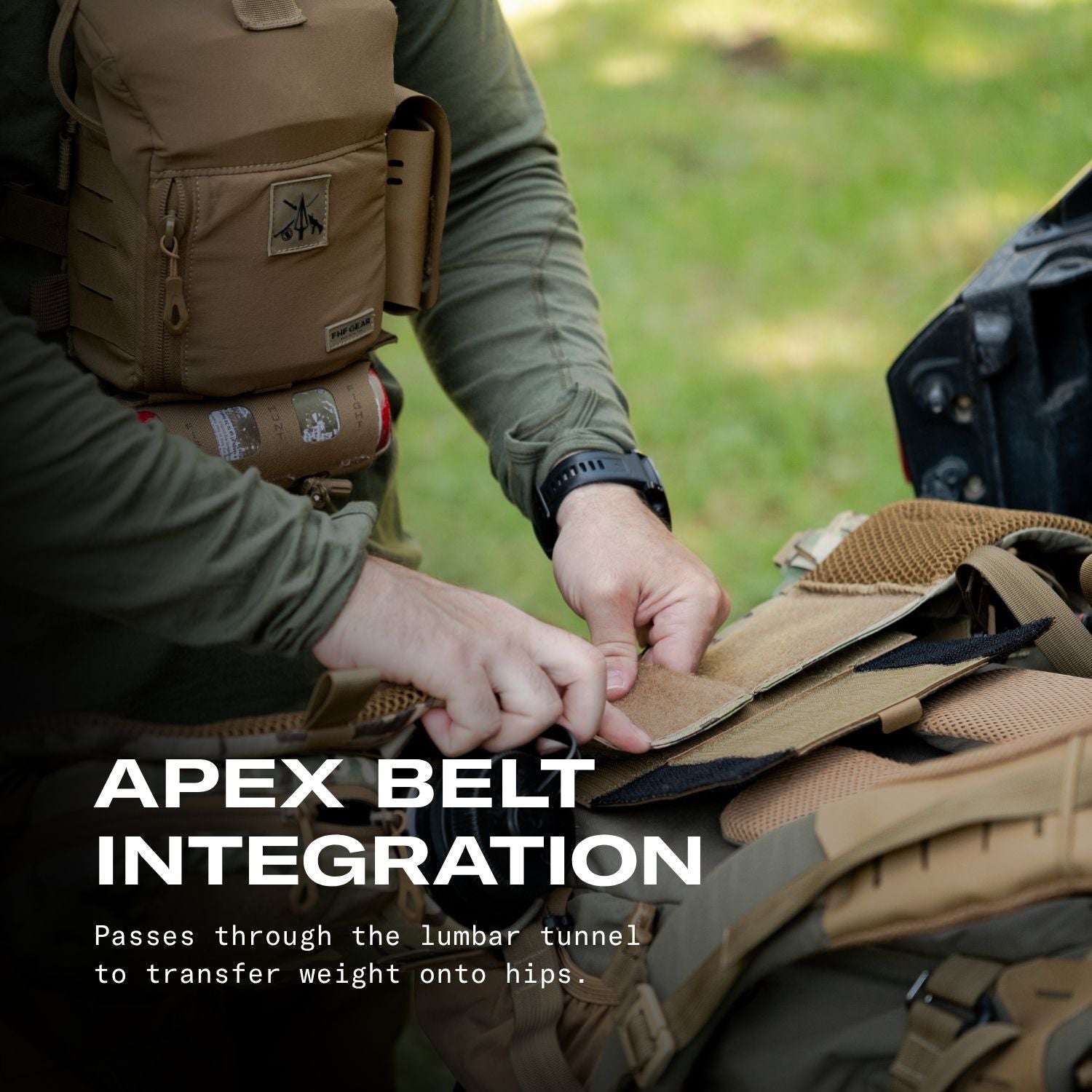 A person outdoors adjusts a tan tactical backpack belt attached to a larger bag, with overlaid text reading 'APEX BELT INTEGRATION' and a small logo patch visible on the backpack.