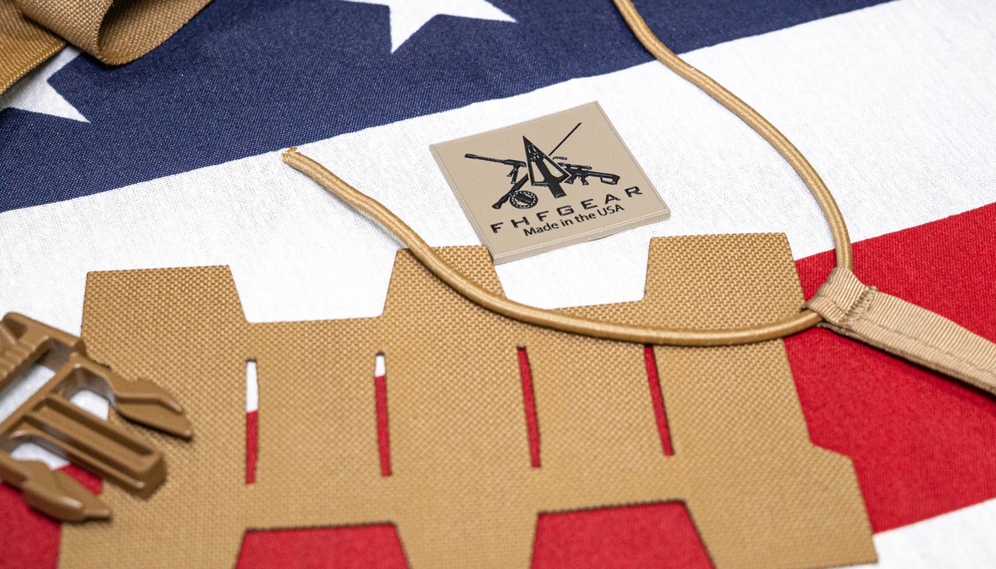 Brown harness components with a FHF Gear label on a U.S. flag background