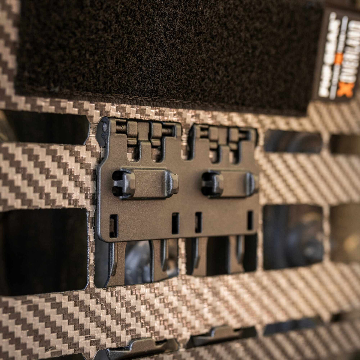Black Snapcor buckle  mounted on a multi-point webbing strap.