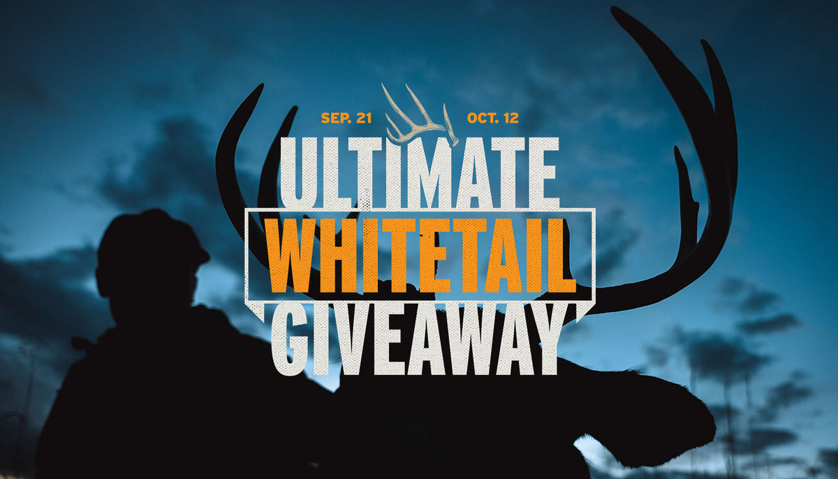 Promotional graphic for an 'Ultimate Whitetail Giveaway' with large white and orange text over a dark blue sky background, a silhouetted hunter on the left, and a deer antler silhouette.